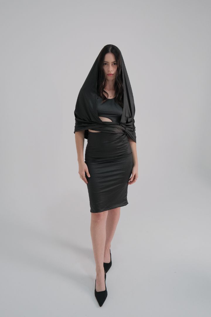 Model wearing the Obscura Dress with hood up, showcasing its sculpted fit and moody vibe