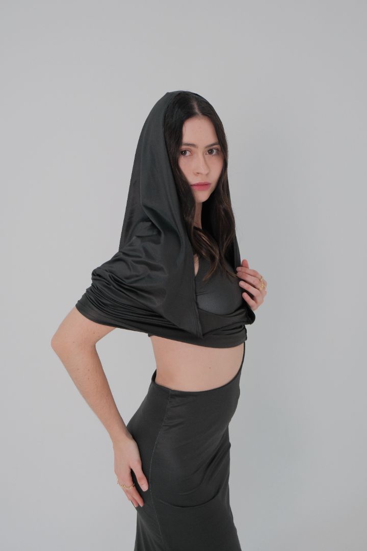 Side view of Obscura Dress worn as a two-piece look with ruched detail and hood off shoulders